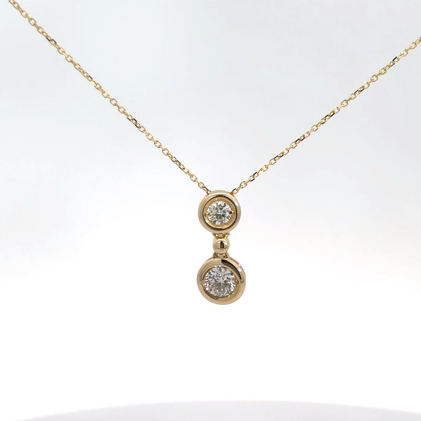 Yellow Gold Two Diamond Bezel Pendant .65cttw