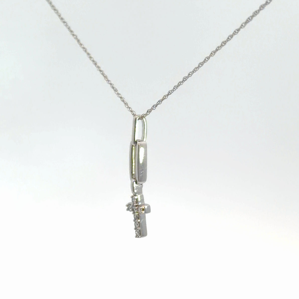 Lady's 14k white gold diamond cross .10cttw