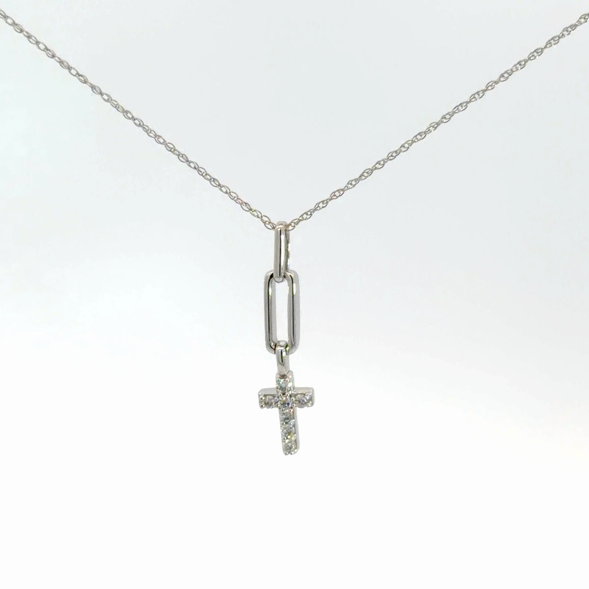 Lady's 14k white gold diamond cross .10cttw