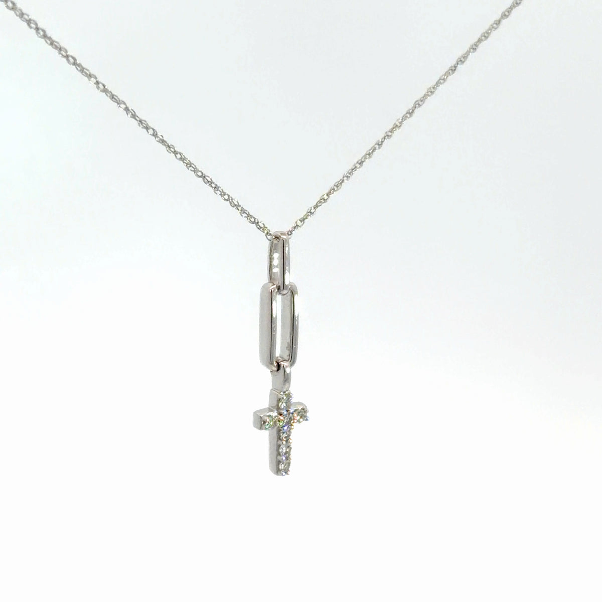 Lady's 14k white gold diamond cross .10cttw